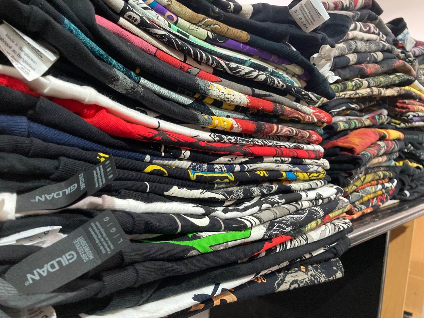 Bulk stack of finished custom printed band T-shirts
