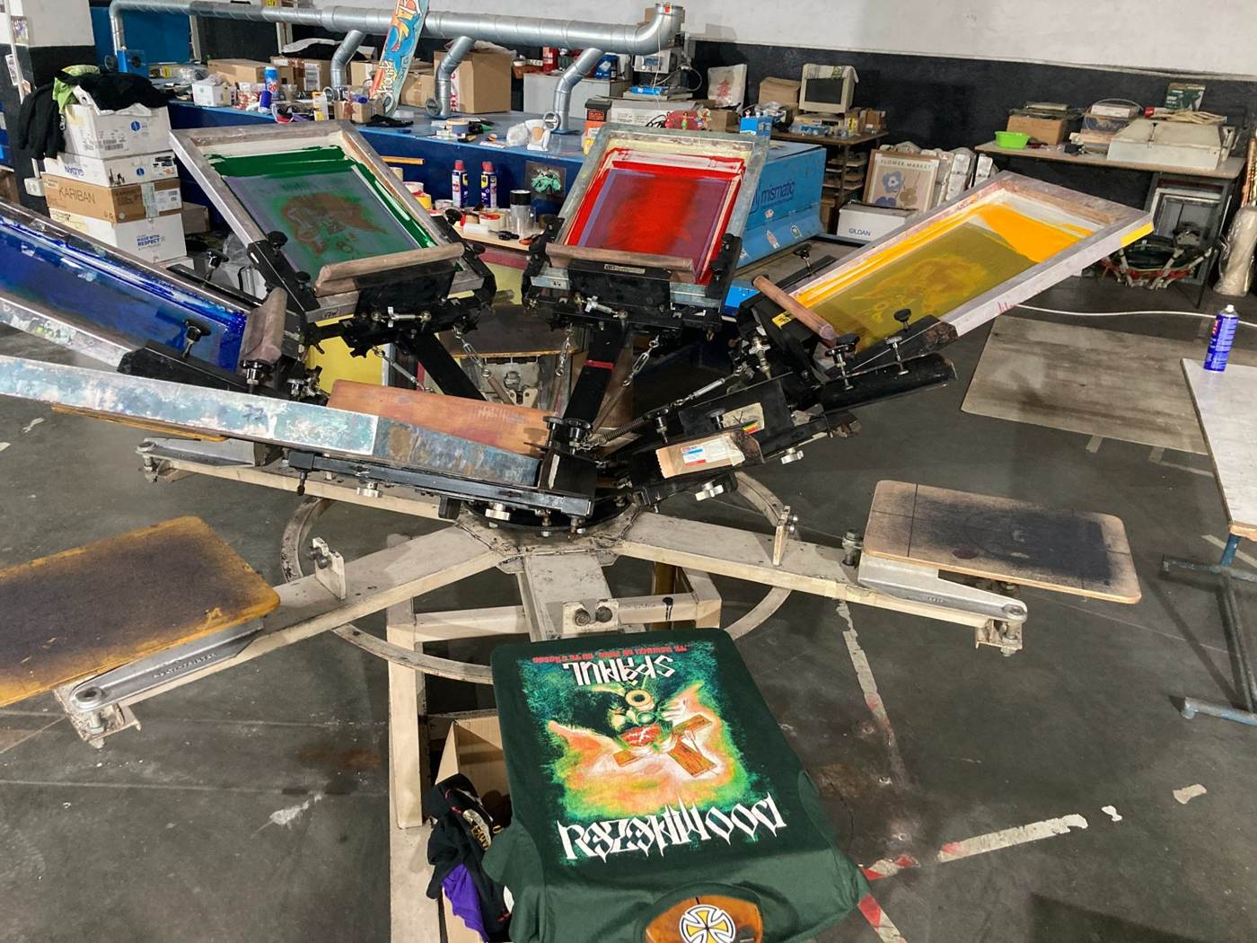 Multi-color manual screen printing press inside the Kraken workshop