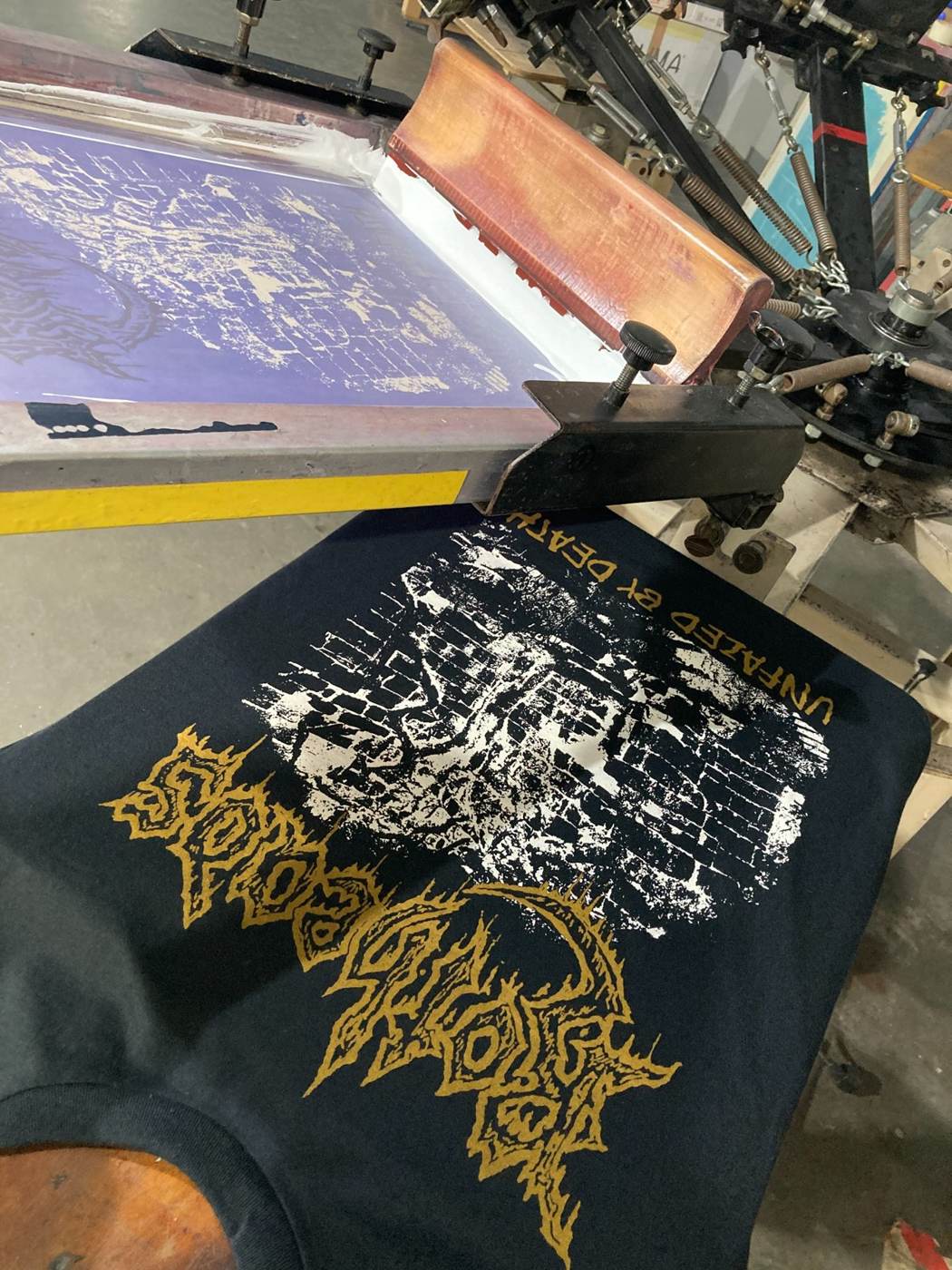 Gold and white custom screen print for heavy metal band merchandise